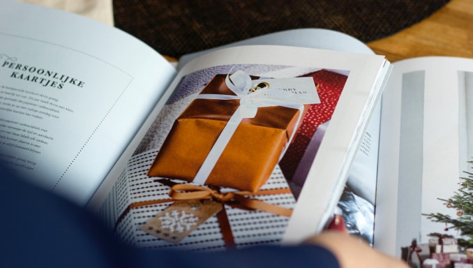 Person flipping through brochure pages